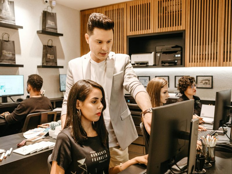 A diverse team collaborates in a modern office environment, fostering innovation and productivity.